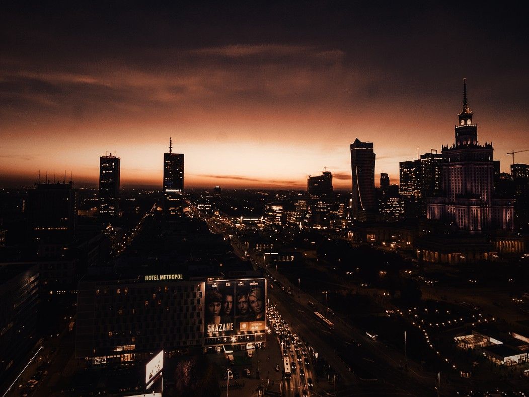 Warsaw city centre at dusk with the Palace of Culture and Science and the office towers around it
